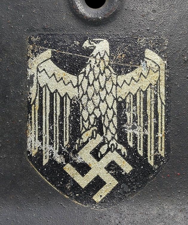 Decal on an M40 EF. The manufacturer of this decal was Huber- Jordan & Koerner. This is an early version of an HJ & K with a large left talon on the right foot.