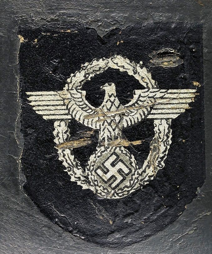 Polizei decal (borderless) on an M35 Quist. This decal is another version used on Quist helmets and differs from the Quist decal displayed above. Note that the decal has been placed on top of another decal with a layer of paint in between. Both M35 Quist helmets were found in the same area in Norway. They are the same size 66 and have the same lot number.
