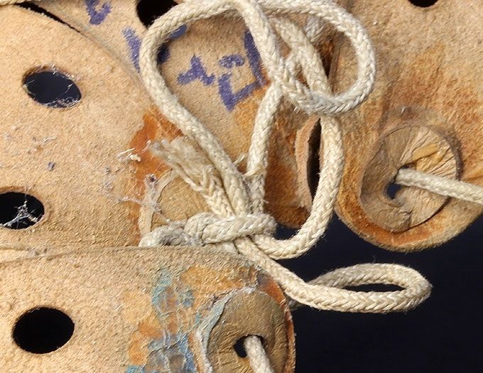 The inside of a liner showing the leather reinforcements that were glued to the backside tip of each tongue.