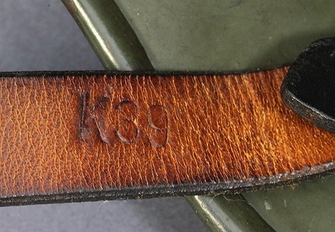 K39 stamp on the long part of the chinstrap near the retaining stud.