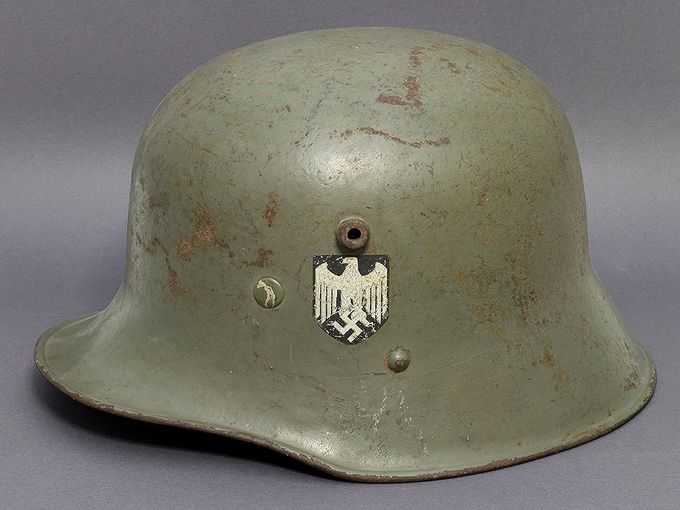 M17 Austrian-manufactured helmet. Notice the high position of the chinstrap lug just below the right side of the decal. This decal is an early type with faded lines in the eagle. The paint is an early smooth type (Lars Aasen collection).