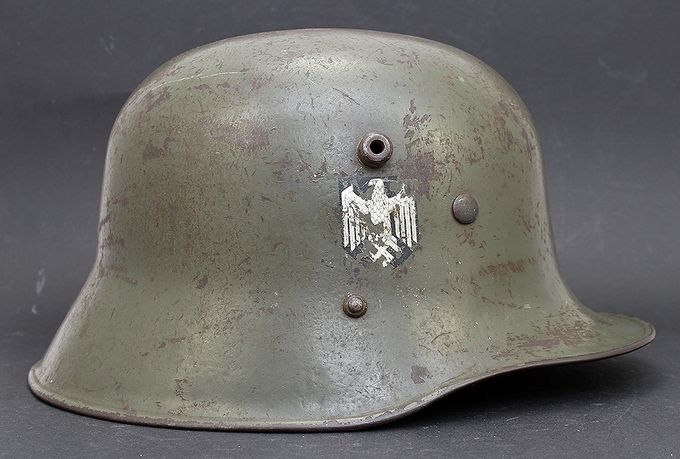 The right side of the helmet above. An ET style decal has been placed where the national shield should have been. Notice the placement of the rivet and the vent 
