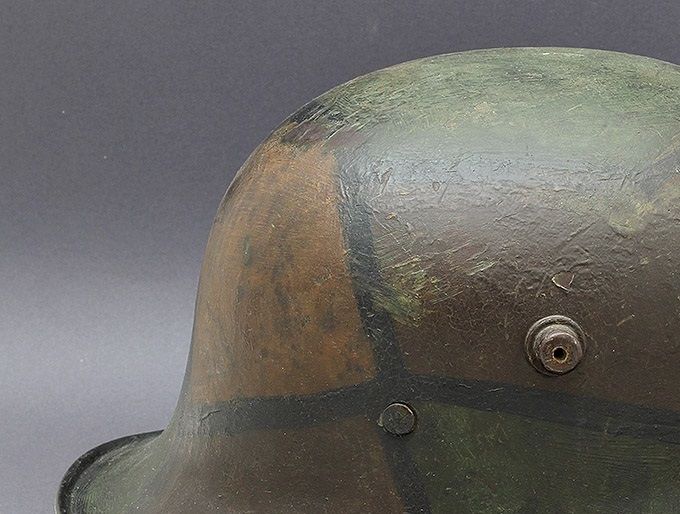 M17 ET64 painted in the classic 1918 camouflage scheme of brown, ochre (yellow-tan) and green with black dividing lines. Notice also the black line which follows the edge of the rim. Purchased in the USA from Paul Dorow.