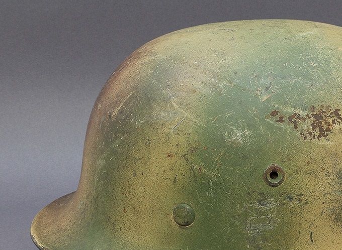 M40 EF66. Tan base with green and brown sprayed on top. Notice the 