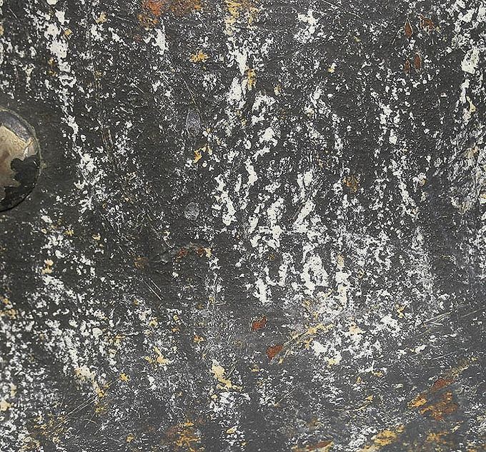 The paint with chalkish whitewash over textured gray paint. 
