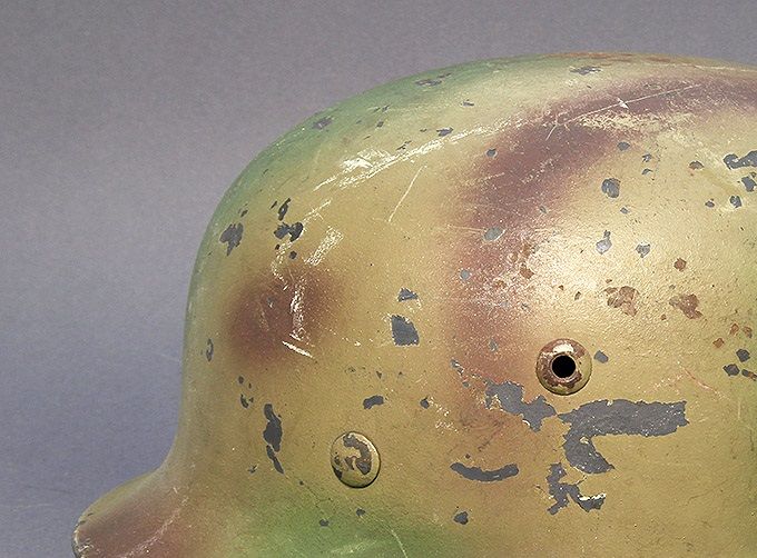 M35 Q66 LW sprayed in a tan base color with green and brown patterns over top. 