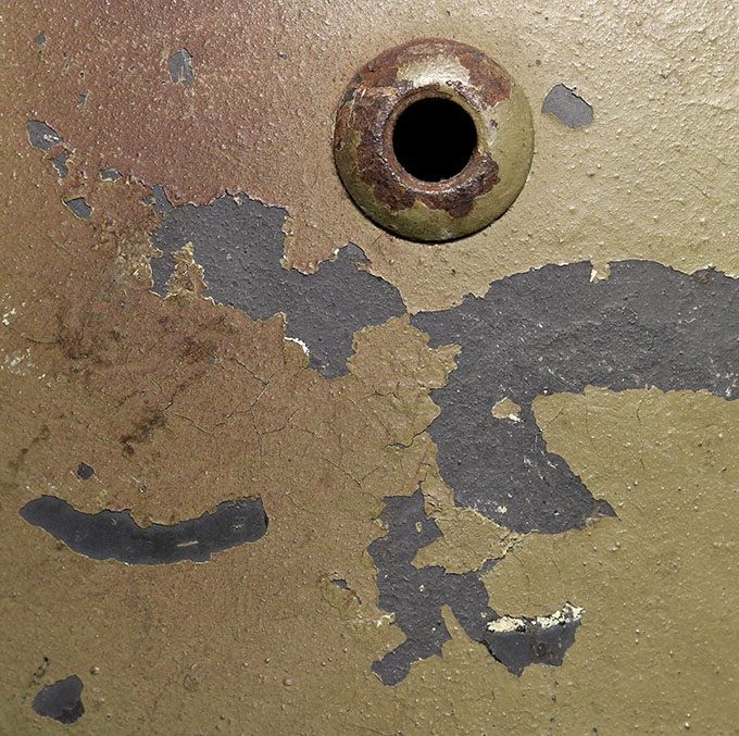 The Luftwaffe decal has flaked off due to poor adhesion to the smooth paint underneath.