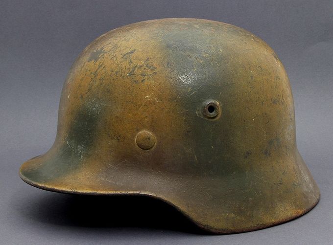 M40 Q62. Mustard yellow base with green and brown sprayed on top in patterns.