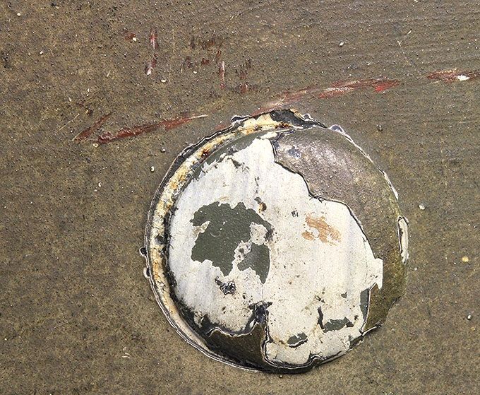 Close-up picture of one of the rivet heads. Notice the winter paint under the flaking camouflage paint.