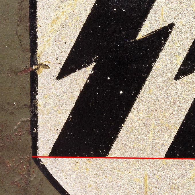 Notice the bottom line of both runes are in line with the point where the shield makes a turn to become narrower and pointed (the «break»).  