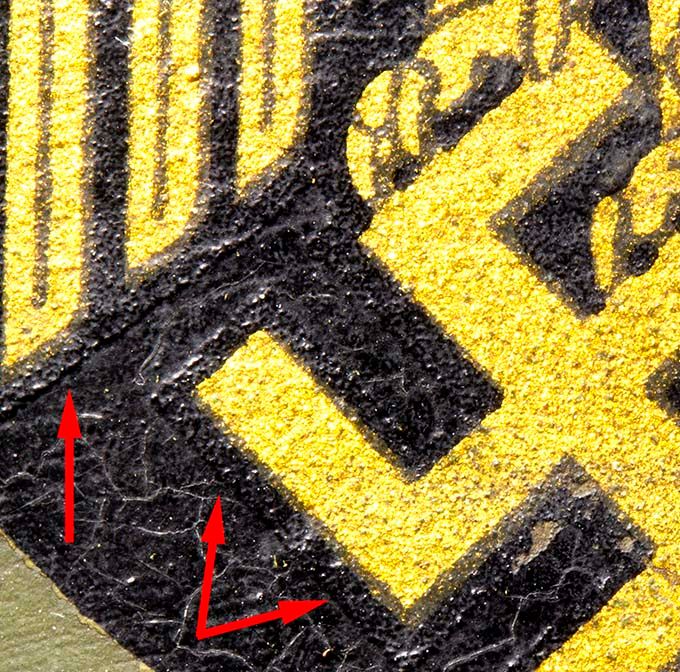 Detail of the black border around the swastika and lower part of wing head. The picture is made more bright to show the border line better.