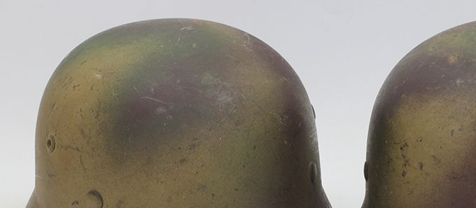 The helmet described above together with an another M35 ET64 camo found in the same county/district in Norway. Same kind of paint pattern, probably from the same German unit.