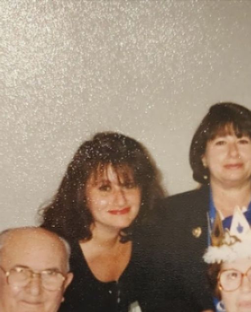 Dad, my two sisters on my mom's birthday; love her crown?