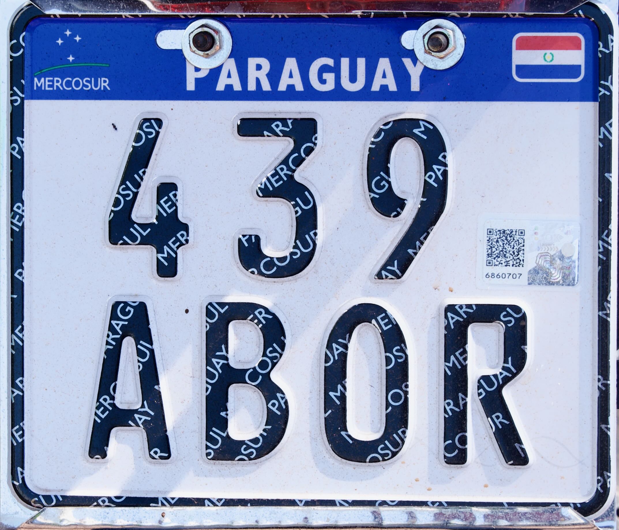 Paraguayan license plates old and new, showcasing historical and modern vehicle registration designs in Paraguay