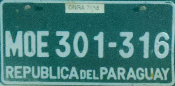 Paraguayan license plates old and new, showcasing historical and modern vehicle registration designs in Paraguay