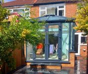 Anthracite grey small uPVC conservatory with French doors