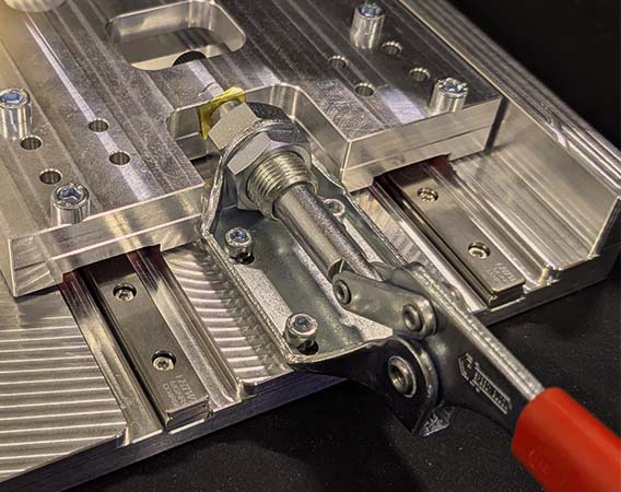 Precision component fixtured on a machined base plate.