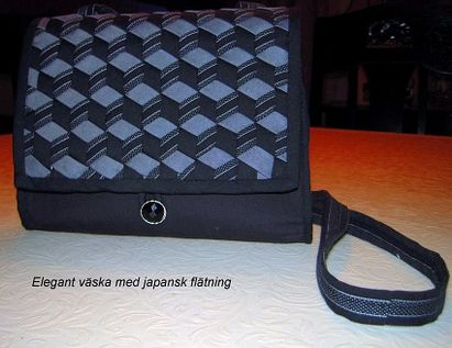 81 svart väska m flätning