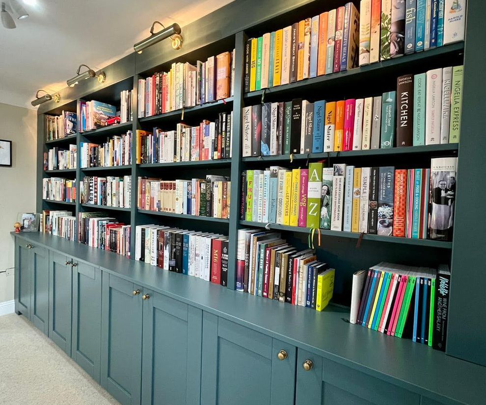 Blue bookself with cupboards installed by Jamie's Interiors