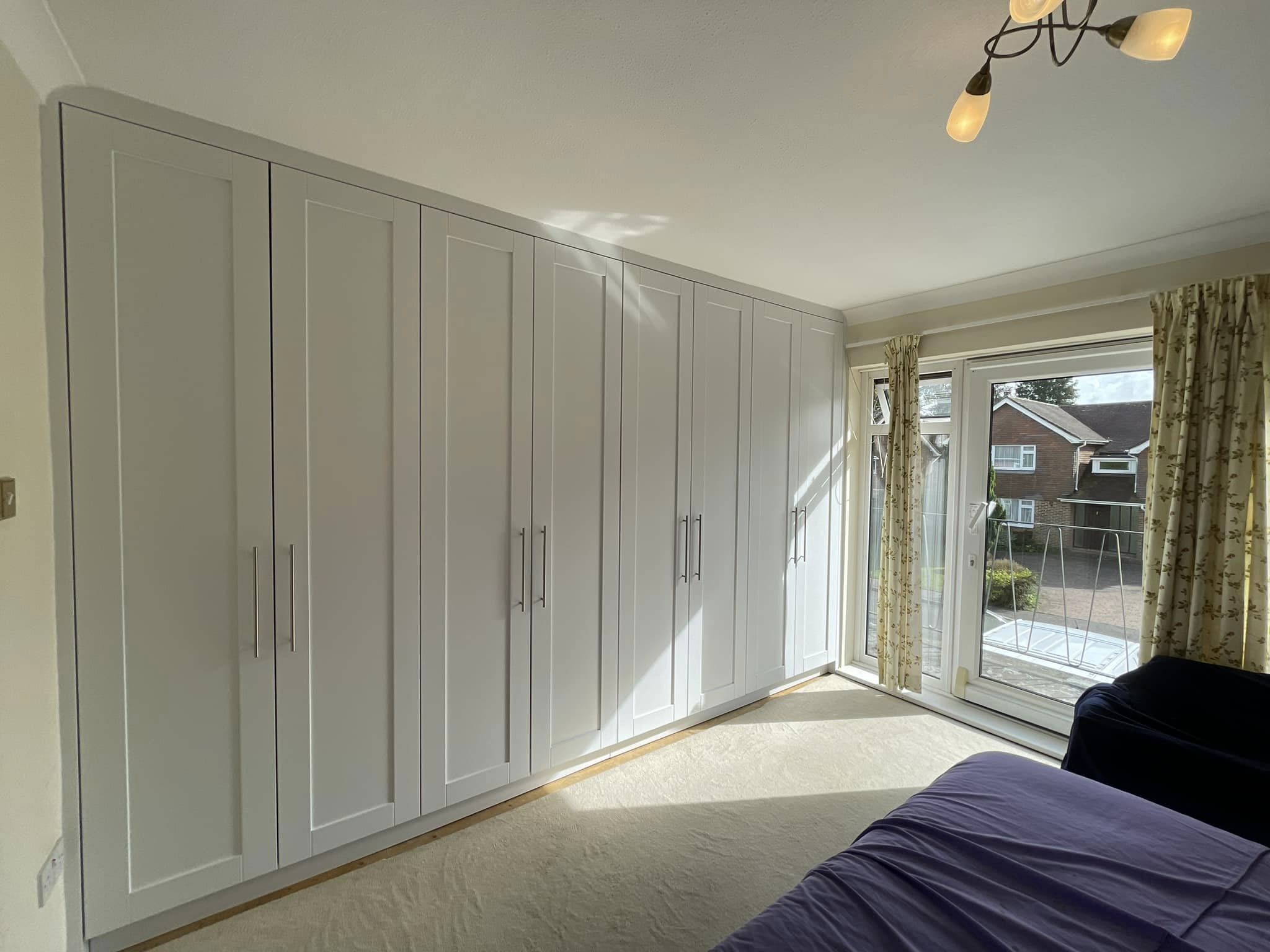 four double door wardrobe with shaker style doors and modern handles