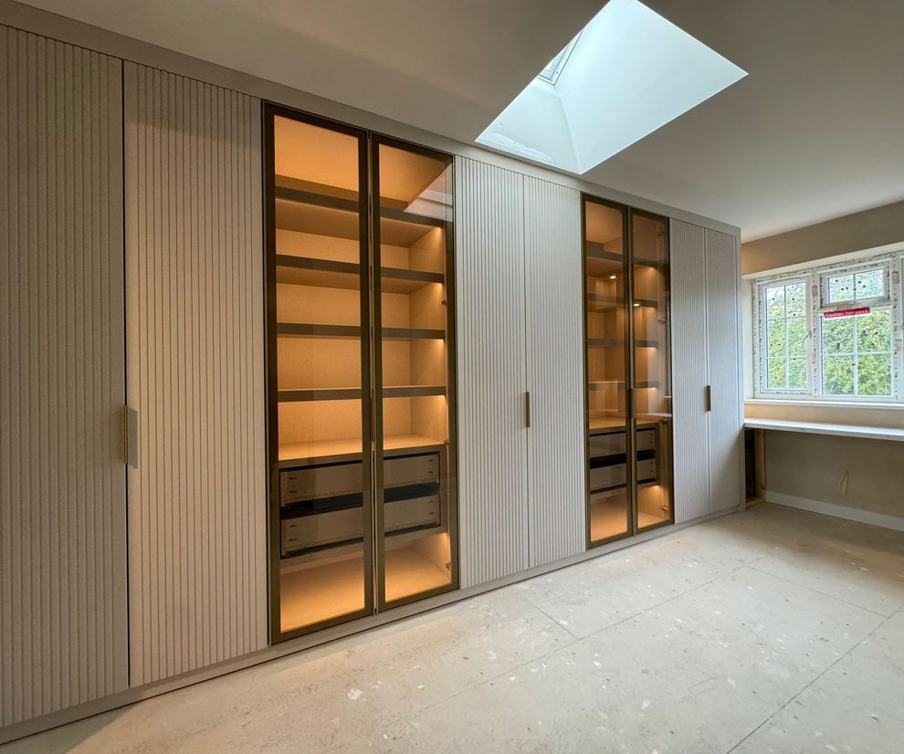 Modern wardrobe with light up shelving and glass doors