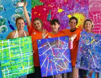 Action painting activity during a fun group event. Action painting activity during a fun group event.
