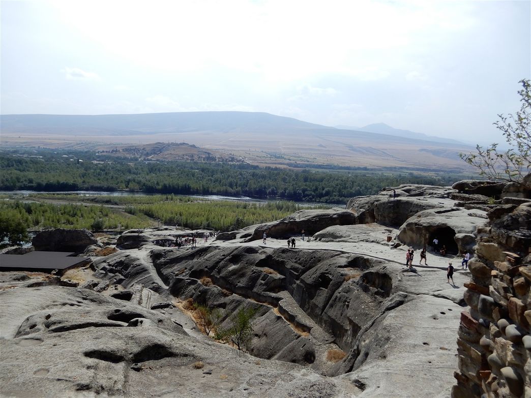 The nature around the Uplistsikhe complex is rewarding, as the river shapes a beautiful valley with scattered mild hills here and there.  The valley is bounded by rocky mountains.