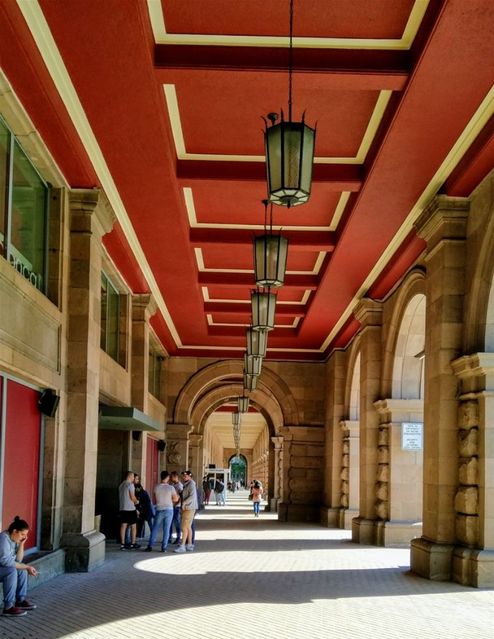 The TSUM arcade, the Largo. TSUM opened in 1957 as a people's department store.  Today it is transformed to become a place for expensive boutiques.  Even though the rents are very high, the store looks gloomy and neglected.