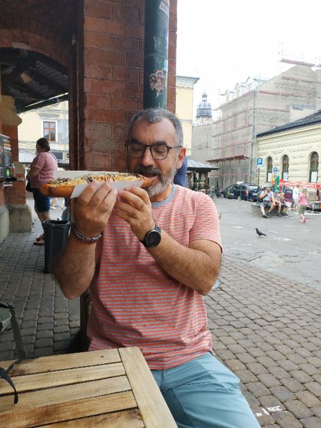 Me enjoying a zapiekanka at Plac Nowy.