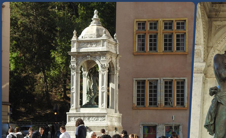 The fountain in the middle of Place Saint Jean, featuring a sculpture of Saint John the Baptist .