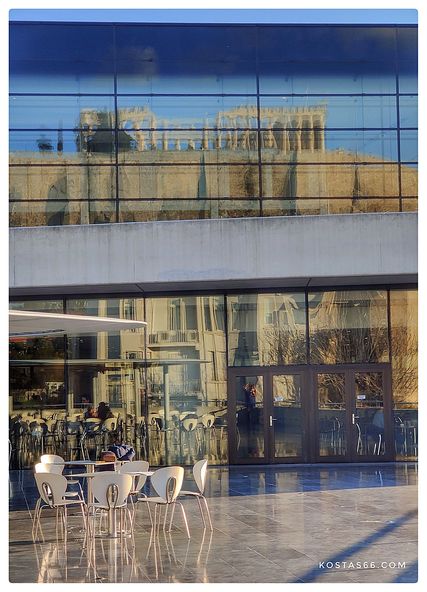 The upper floor of the building reflecting the Acropolis.