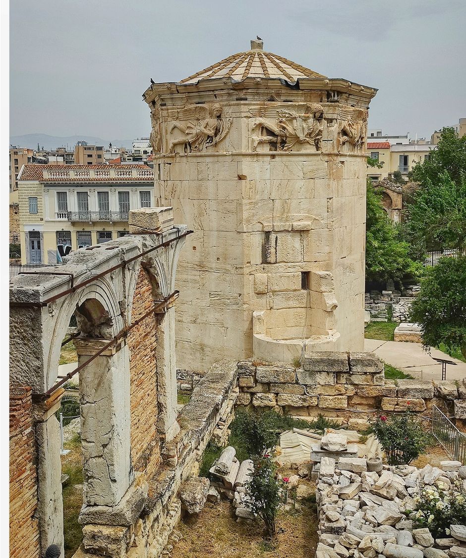 The Tower of the Winds seen from Lisiou street (north). The arches in the foreground belong to the Agoranomion.