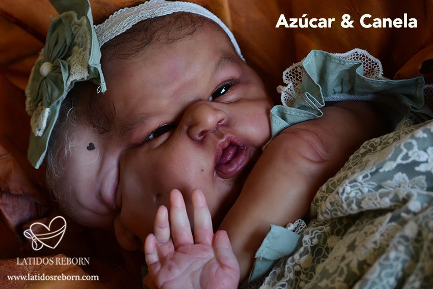 03 AZÚCAR & CANELA logo