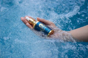 Light Mandalas AquaAurum elixir in water, symbolizing purity and rejuvenation.