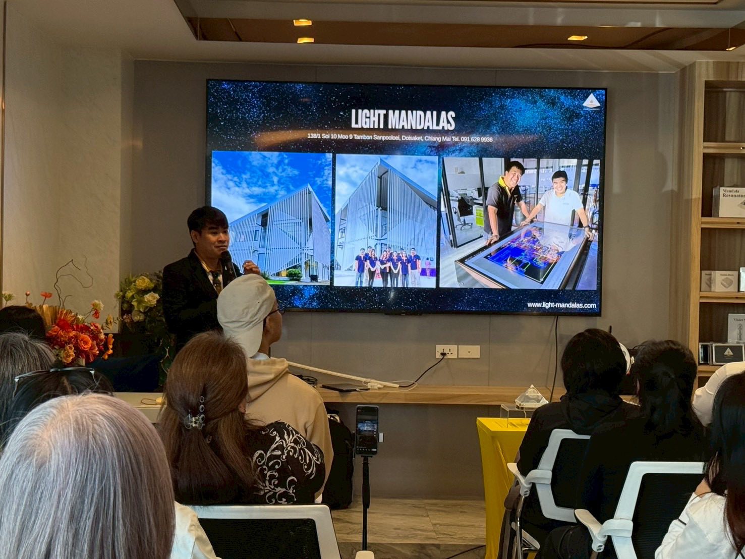 Light Mandalas meeting discussing energy healing technology and wellness solutions.