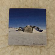 Disktrasa snö runt båthus
