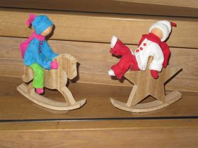 winterpoppetjes op hobbelpaard en kerstster
