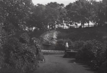 M76 The Dell, Graves Park, girl in light dress at corner of stage, emp