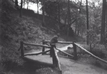 M77 Man leaning on rustic bridge, thought to be in Graves Park