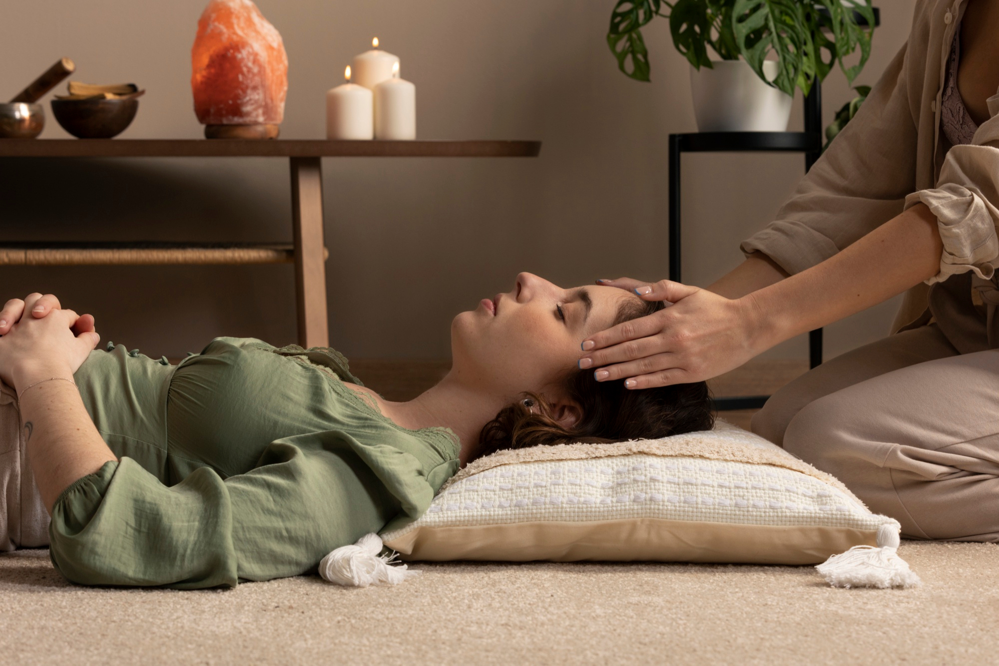 Woman relaxing during reiki session