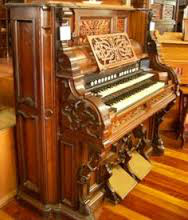 (con't from Part I)
The wedding is in 30 minutes.  The bride and groom have asked you to play the organ for them.  They said the church had a two manual organ with pedals.
You show up, and see this.  A very fine instrument, but not exactly what you expected.
You panic.  There are no pedal keys.  All that wonderful organ music on 3 staves you've been practicing for weeks can't be performed.
You need a big sound, and you want your playing to sound written.  And 2 hands have to do it all, cold turkey.  You've got another emergency on your hands.
Now what.
Just then, you breathe a sigh of relief.  You remember that you have some of those free scores from this web site with you.
And you learned them.
You're saved.