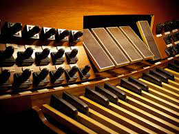 You've been invited to play for this important event on a wonderful pipe organ with which you're very familiar and have performed upon many times before.
You've prepared some wonderful organ music from the literature, know it thoroughly, and arrive an hour before, loaded for bear.
There's only one problem.  You find out that the roof leaked a week ago directly over the Pedal division, carrying rain water and filth from the roof down into the pipes and chests, rendering them unplayable until the organ builder can be summoned to make the needed repairs.
You need a big sound, and you want your playing to sound written.  And that beautiful pedalboard under your feet, for the time being, is useless.  The organ builder has disconnected it until repairs can be made, and manual to pedal coupling is impossible.  The manuals have to do it all.  You've got an emergency on your hands.
Now what.
Then you remember, you've got this problem solved.  You heave a sigh of relief.  You've got some of those free scores from this web site with you.
And you learned them.
You're saved.
(con't in Part II)
