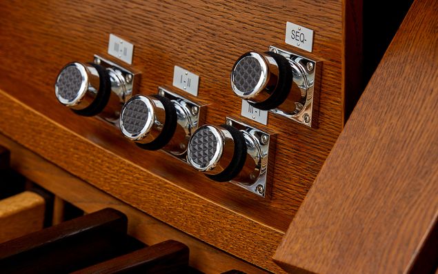 The console's combination action, capture system, or piston system provided by the builder allows the player to bring on or retire pre-programmed stop and coupler combinations simply by pushing a single piston button with a thumb or a single toe piston with a toe.
NOTE:  Toe pistons (photo) are located just above the pedal keys to be easily accessible by the organist's foot.
The so-called general piston sequencer, sometimes called a stepper piston, is a relatively new device that allows the player to move through a pre-programmed sequence of general piston combos, either up or down, by repeatedly pushing the same centrally-located toe piston (labeled 