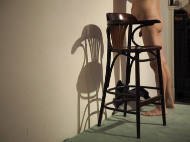 Wooden chairs and the artist's muse