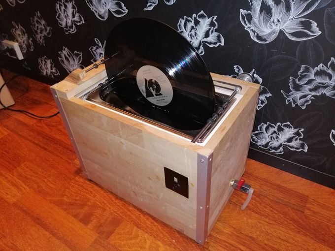 Diy ultrasonic record cleaner.  100W  40KHZ .9 steps  Adjustable  speed control with remote control.Step 1. 1 hour per revolution. step 9. 1 min per revolution. Total cost for this machine was about 100 usd including filtering system.