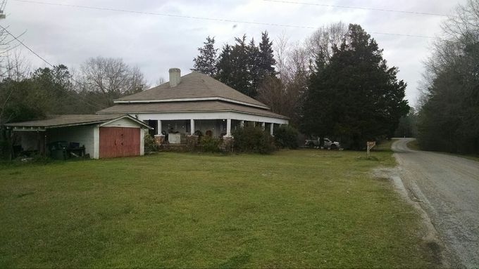 This is the home where Ben Frank Atkins grew up, located on Atkins Road.  Ben's father, Floy Atkins, had worked an extra 5 years, until he was 70, before he decided to retire so that he would have a greater retirement income.   He retired on Friday.  The next day he was attempting to pull a stuck tractor from a muddy field behind this house.  When he began to tighten the pulling cable the tractor he was on flipped over backwards with him underneath, taking his life,
 less than 24 hours from his last day at work.