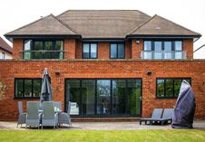 Rear: Reynaers Aluminium bifold doors, French doors, windows