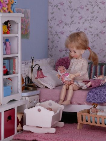Emily is putting her babies to bed.