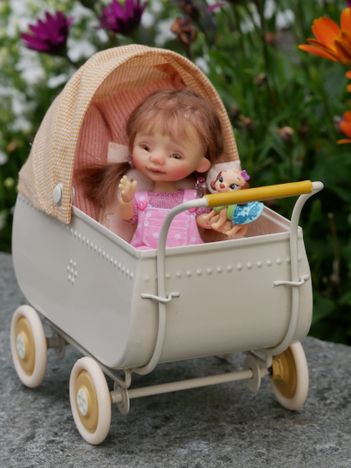 Happy in her pram
