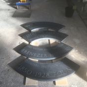 Carved outer sections of slate laid out in Ben's studio
